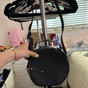 black circle crossbody bag